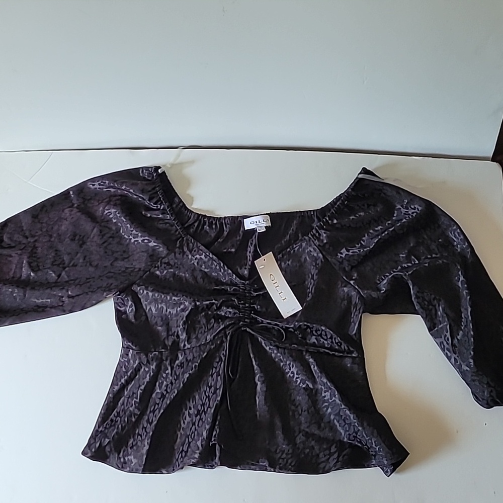 On trend leppard print all black top.  It could likely be worn all year long.